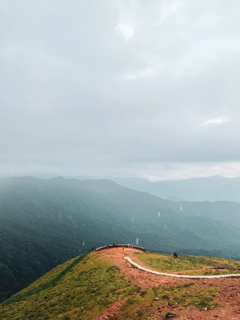 A rainy Madikeri viewpoint illustrating the landscape around a Coorg weekend